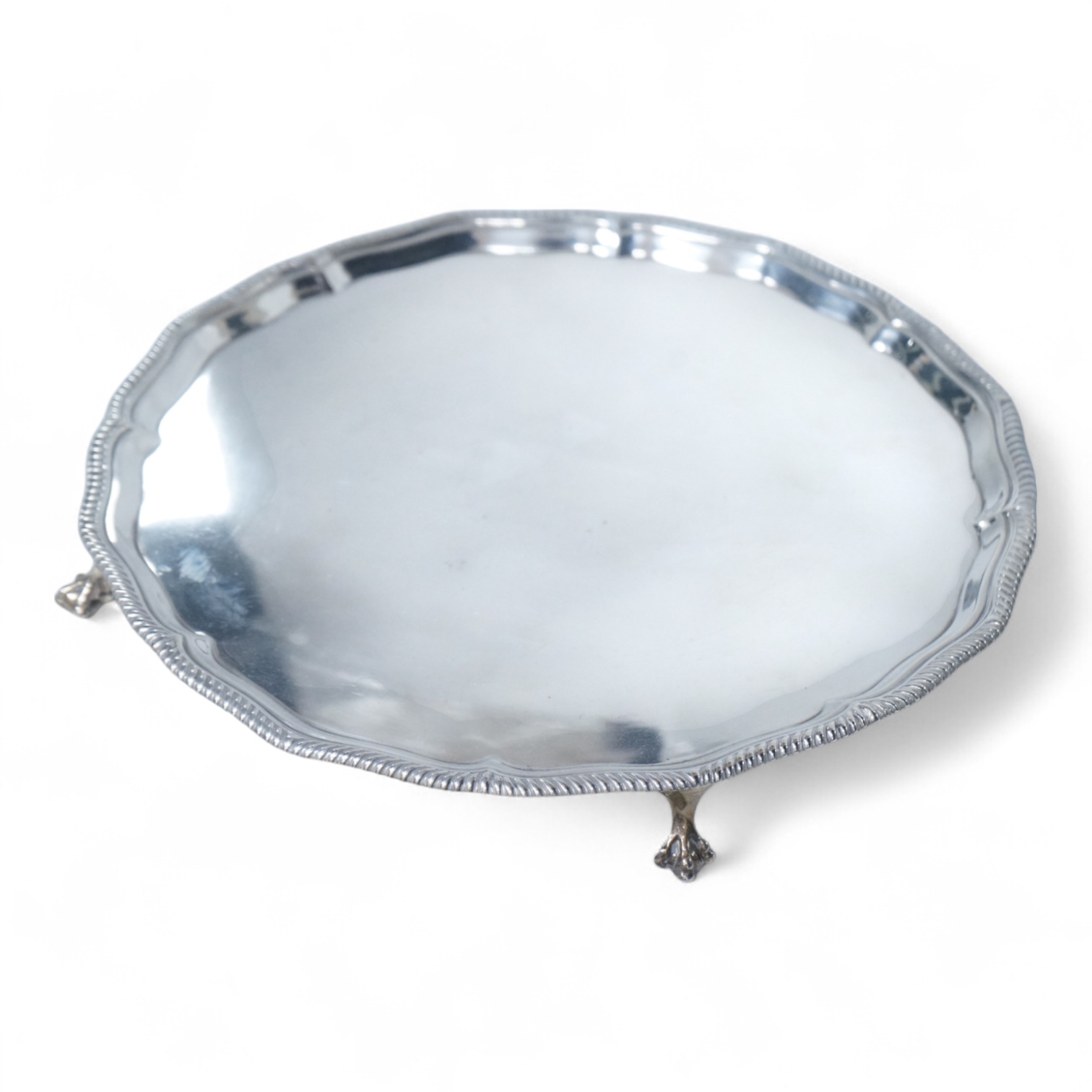 A George V silver salver, of shaped circular form, with gadrooned border, on four claw and ball feet, Thomas Bradbury & Sons, Sheffield, 1918, diameter 30.8cm, 27.2oz.